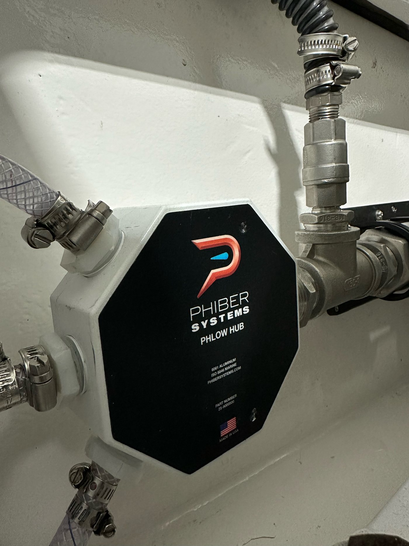 PHLOW Hub installed in a boat with hoses connected