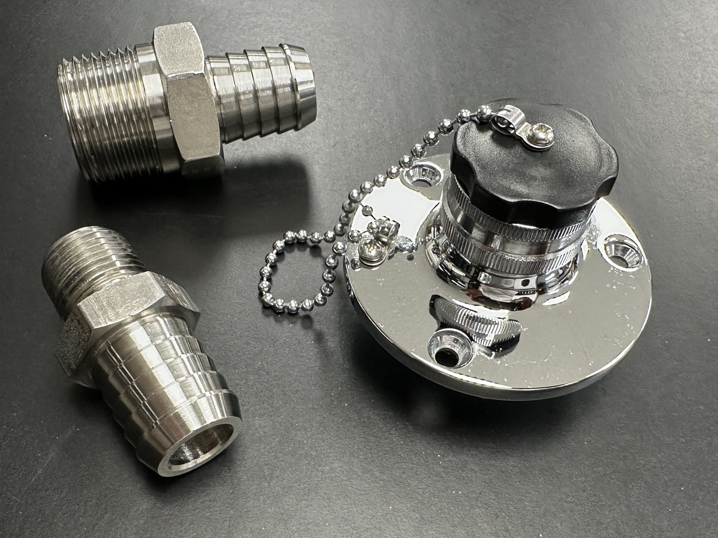 Stainless NPT-to-barb fittings and a Perko style dock hose inlet
